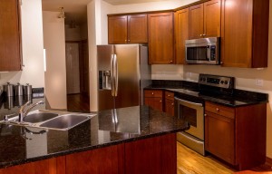 upgraded kitchen with granite countertops and stainless steel appliances